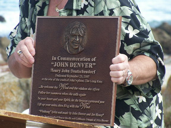 Ron Deutschendorf holding plaque
